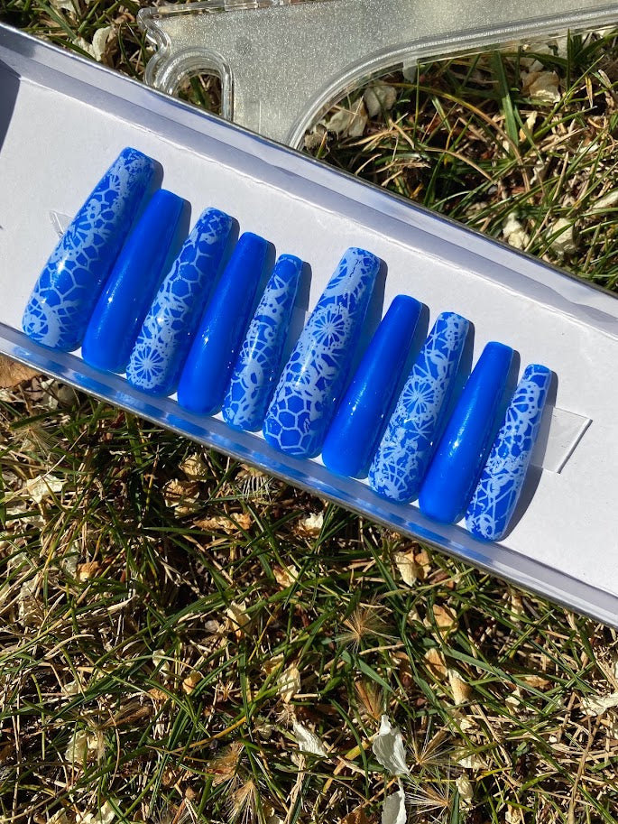 Royal blue coffin press-on nail set with white lace snowflake and floral nail art